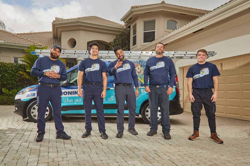 HVAC service Boca Raton FL technician servicing residential heating and cooling system