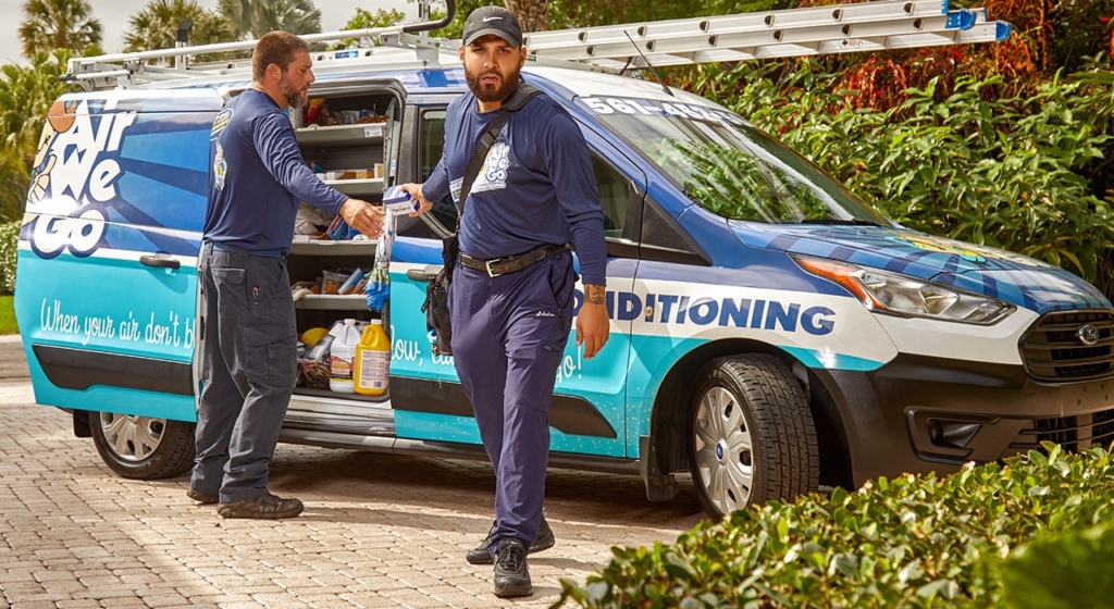 AC service Palm Beach County FL technician servicing residential AC system