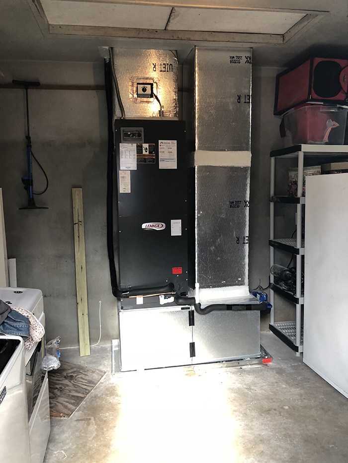 Furnace installation Palm Beach County technician installing residential furnace system