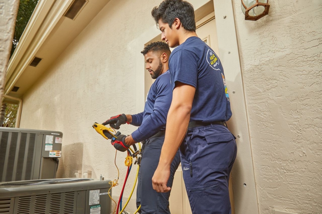 AC service Boca Raton FL technician servicing residential AC system