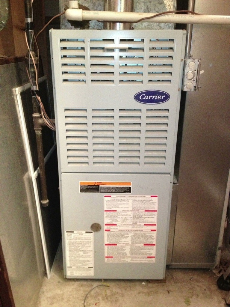 Furnace repair Palm Beach County technician servicing residential furnace system